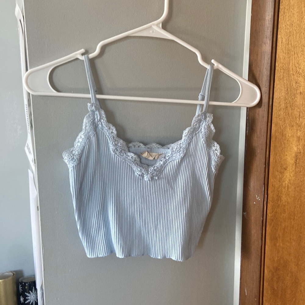 Brand NEW without tags, light blue, stretchy, lace trim around the chest area